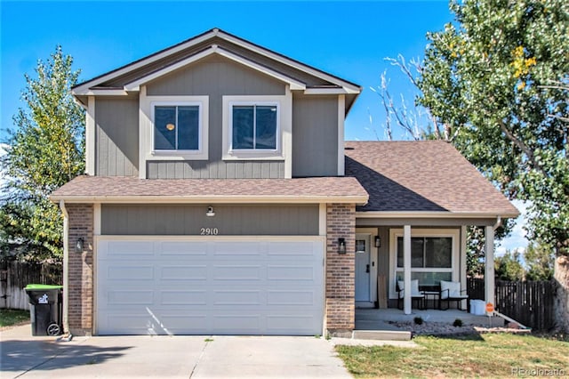 view of front of home with a garage and covered porch