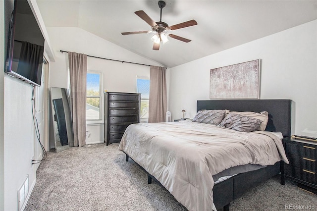 carpeted bedroom with ceiling fan and lofted ceiling