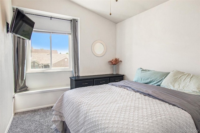 bedroom with carpet and vaulted ceiling