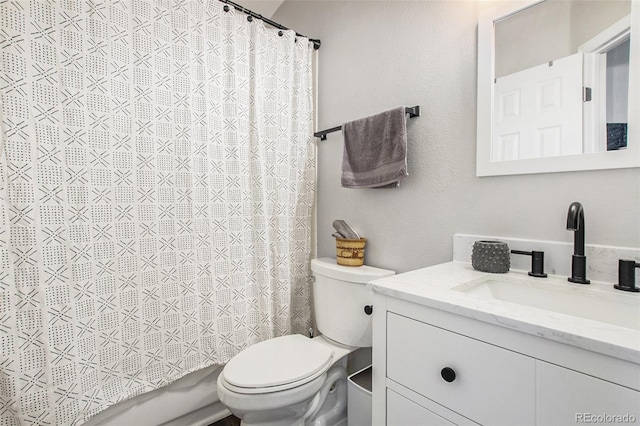 full bathroom featuring vanity, toilet, and shower / bath combination with curtain