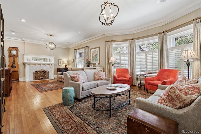 836 E 17th Ave Unit 1A, Denver, CO 80218 - living area featuring a chandelier, recessed lighting, light wood-style floors, a fireplace, and crown molding