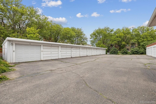836 E 17th Ave Unit 1A, Denver, CO 80218 - garage featuring view of scattered trees