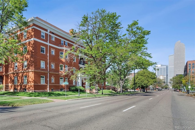 836 E 17th Ave Unit 1A, Denver, CO 80218 - view of asphalt road featuring sidewalks, curbs, and street lights
