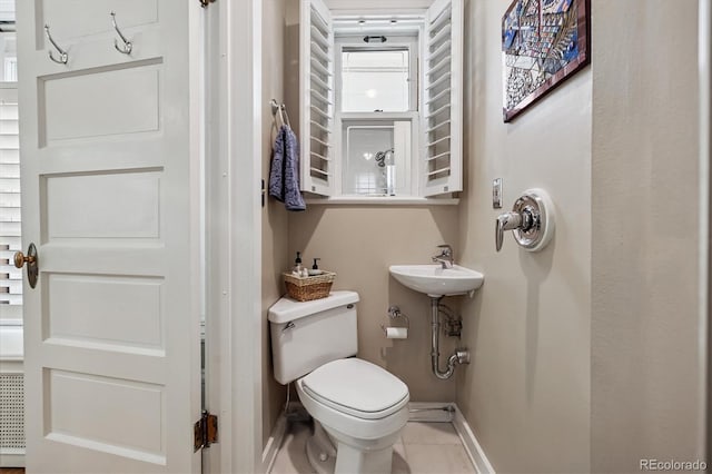 836 E 17th Ave Unit 1A, Denver, CO 80218 - bathroom featuring baseboards and tile patterned flooring