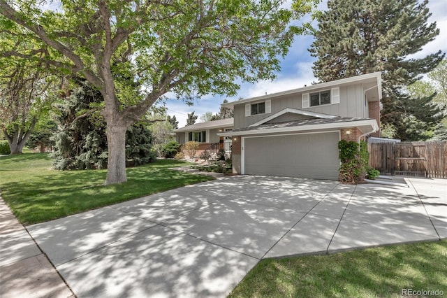 6211 S Garfield Dr, Centennial, CO 80121 - tri-level home featuring board and batten siding, driveway, brick siding, and an attached garage