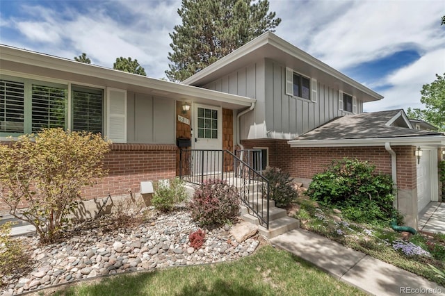 6211 S Garfield Dr, Centennial, CO 80121 - tri-level home featuring brick siding and board and batten siding