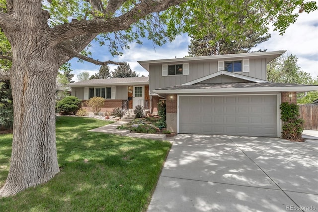 6211 S Garfield Dr, Centennial, CO 80121 - split level home featuring brick siding, a garage, driveway, and board and batten siding