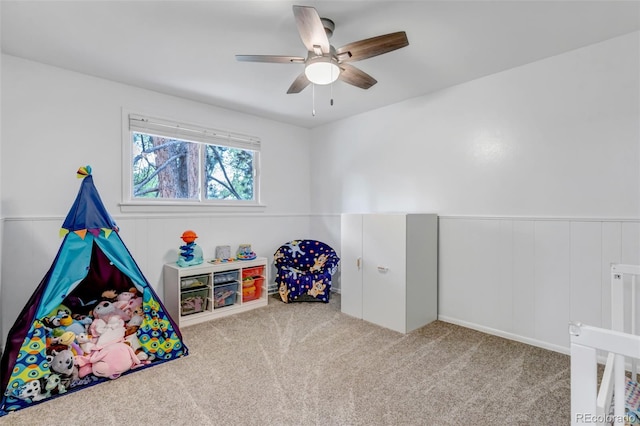 6211 S Garfield Dr, Centennial, CO 80121 - recreation room featuring carpet flooring, a ceiling fan, and a wainscoted wall