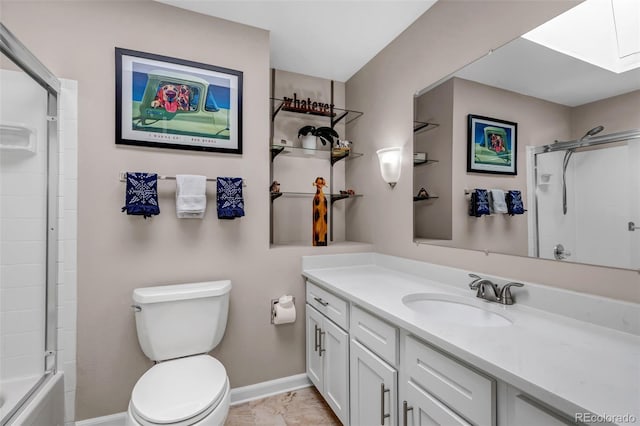 6211 S Garfield Dr, Centennial, CO 80121 - full bath with vanity, toilet, baseboards, and a skylight