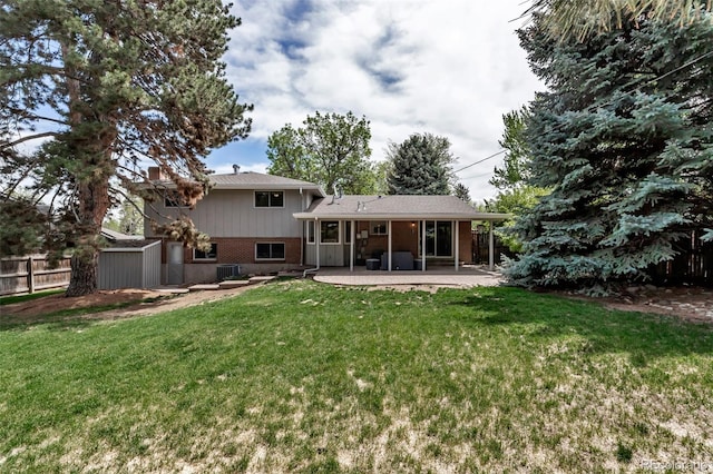 6211 S Garfield Dr, Centennial, CO 80121 - back of house featuring a patio area and brick siding