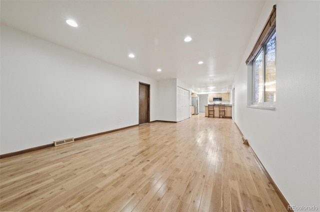 unfurnished living room featuring light hardwood / wood-style flooring