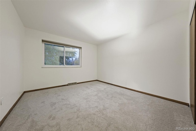 view of carpeted spare room