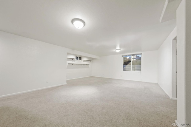 unfurnished room featuring light colored carpet