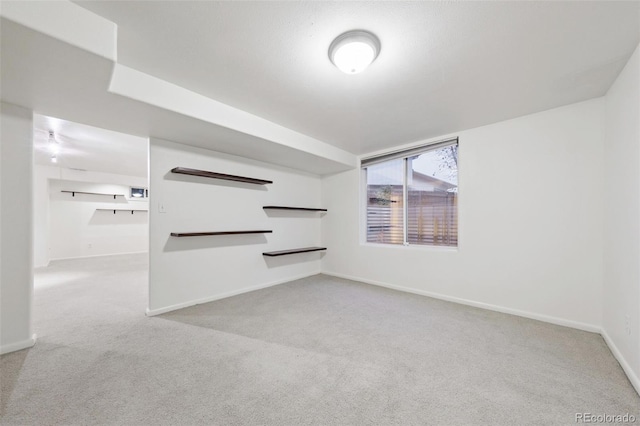 unfurnished living room featuring light colored carpet