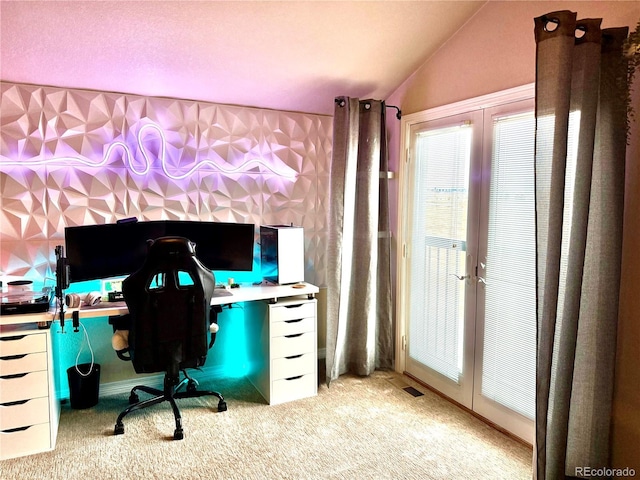 office space with light carpet, visible vents, french doors, and lofted ceiling