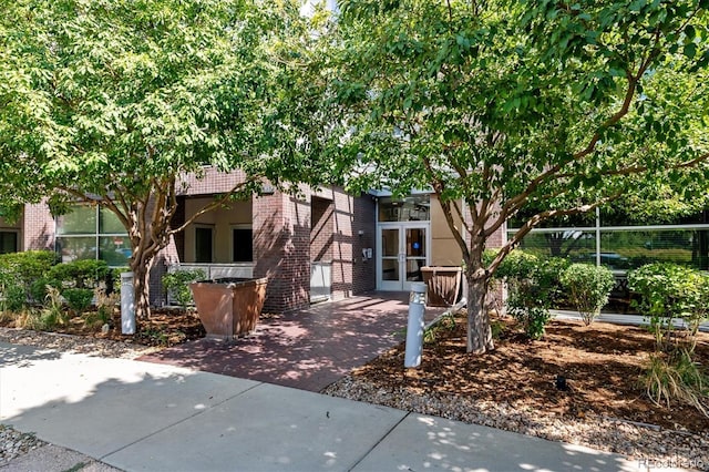 2958 Syracuse St Unit 214, Denver, CO 80238 - view of front facade featuring brick siding and french doors