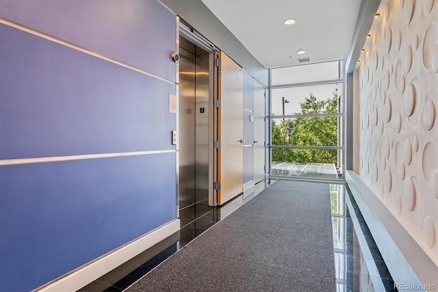 2958 Syracuse St Unit 214, Denver, CO 80238 - hallway featuring granite finish floor, expansive windows, baseboards, elevator, and recessed lighting