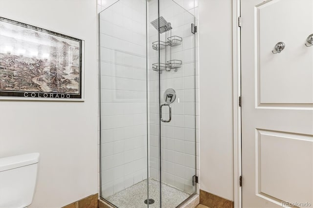 2958 Syracuse St Unit 214, Denver, CO 80238 - bathroom featuring a stall shower and toilet