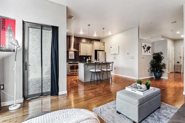 2958 Syracuse St Unit 214, Denver, CO 80238 - living area with visible vents, recessed lighting, baseboards, and wood finished floors