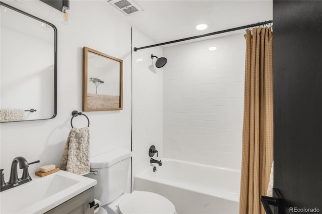 full bathroom with shower / bath combination with curtain, toilet, and sink