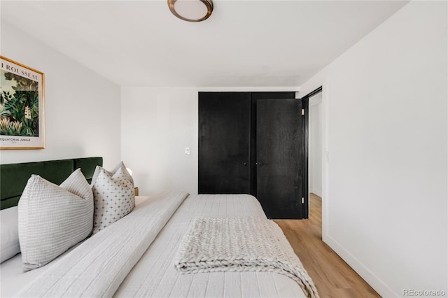 bedroom with light hardwood / wood-style flooring