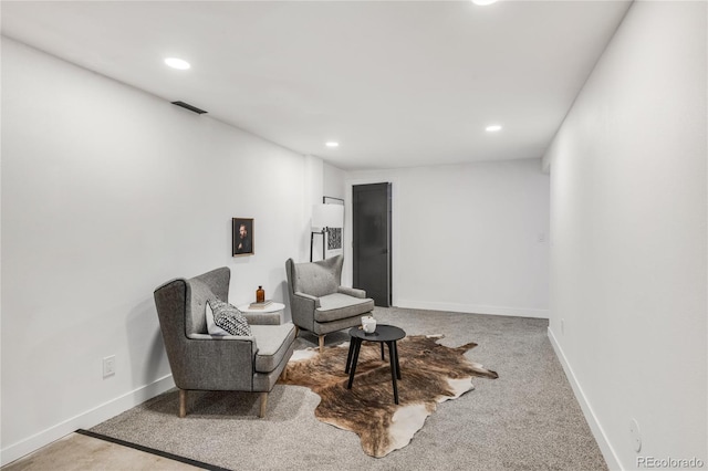 sitting room featuring carpet flooring