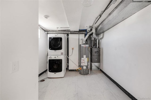 washroom with water heater and stacked washer and clothes dryer