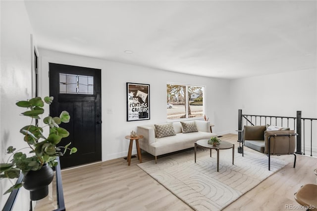 living room with light hardwood / wood-style flooring