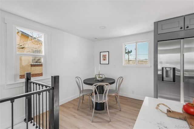 dining space featuring light hardwood / wood-style flooring