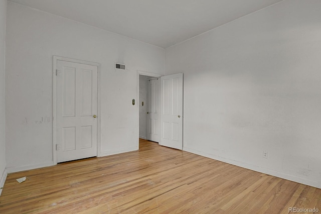 spare room featuring light hardwood / wood-style floors