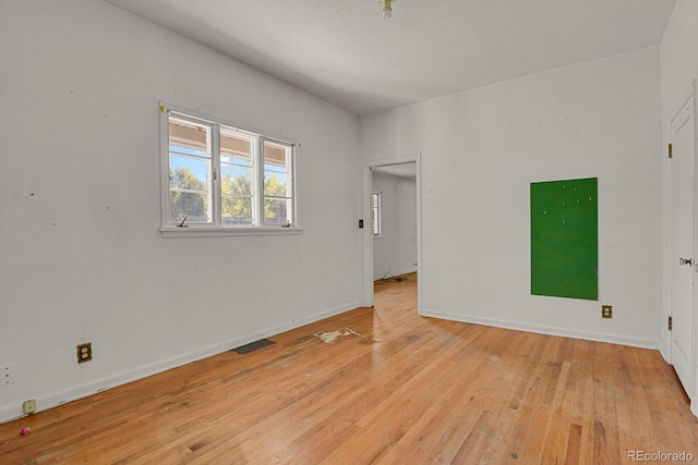 unfurnished room featuring light hardwood / wood-style flooring