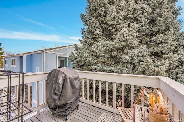 wooden terrace with area for grilling