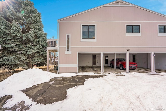 view of property exterior with a carport