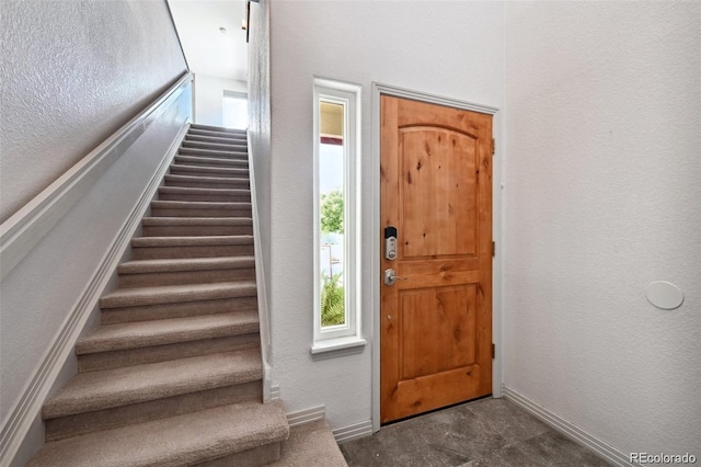 920 S Locust St Unit E, Denver, CO 80224 - foyer entrance featuring stairway and a textured wall