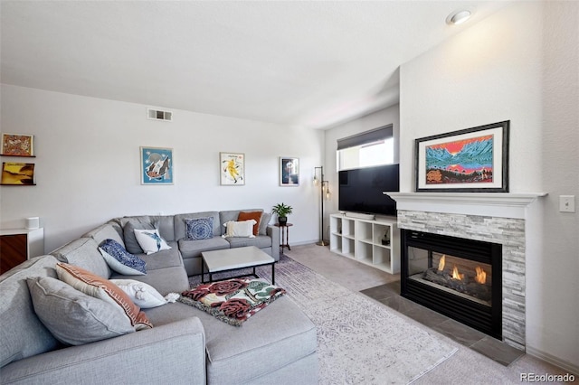 920 S Locust St Unit E, Denver, CO 80224 - living area featuring carpet flooring and a stone fireplace