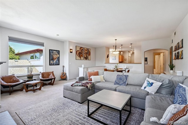 920 S Locust St Unit E, Denver, CO 80224 - carpeted living area with arched walkways