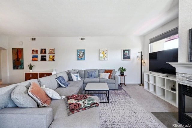 920 S Locust St Unit E, Denver, CO 80224 - carpeted living room with a fireplace