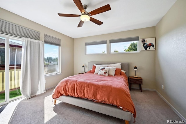 920 S Locust St Unit E, Denver, CO 80224 - bedroom with access to exterior, multiple windows, carpet floors, and a ceiling fan