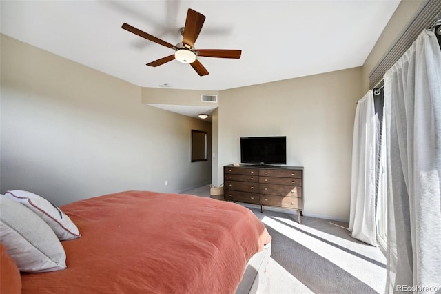 920 S Locust St Unit E, Denver, CO 80224 - carpeted bedroom with baseboards and a ceiling fan