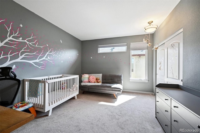 920 S Locust St Unit E, Denver, CO 80224 - bedroom featuring carpet and a nursery area