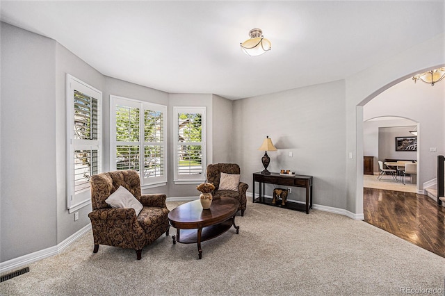 living area with hardwood / wood-style flooring