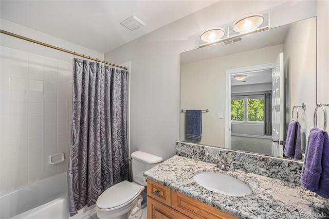 full bathroom featuring vanity, toilet, and shower / tub combo with curtain