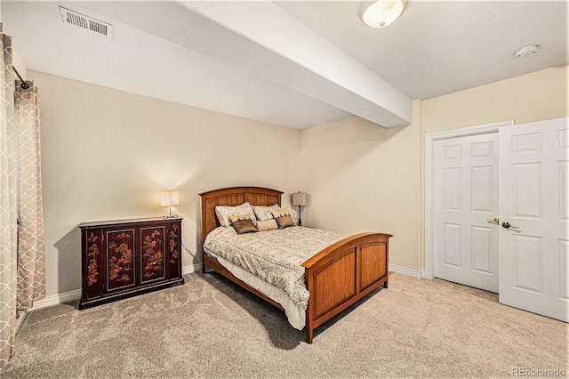 bedroom featuring light carpet