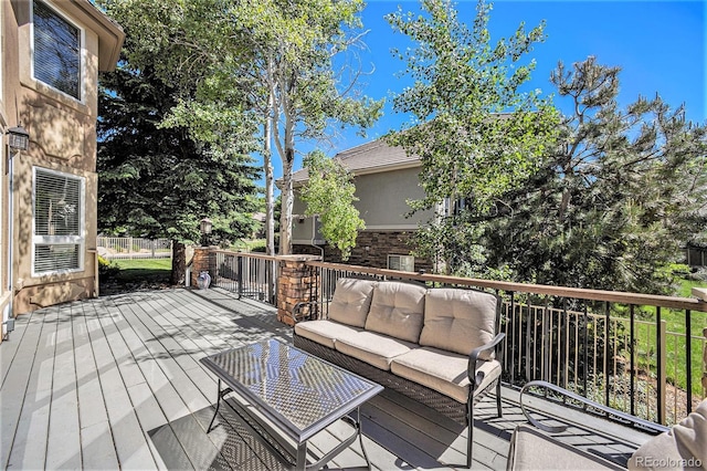 wooden deck featuring an outdoor hangout area