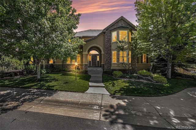 view of front of home with a yard