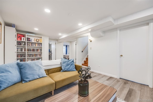 living room featuring stairway, recessed lighting, and light wood-style floors