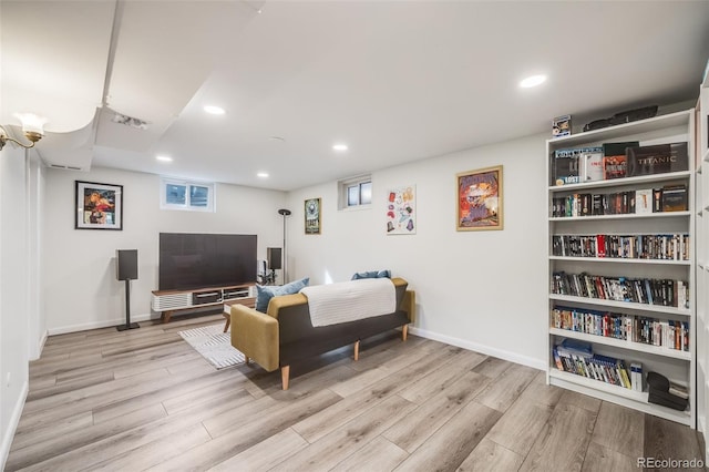 sitting room featuring recessed lighting, baseboards, and wood finished floors