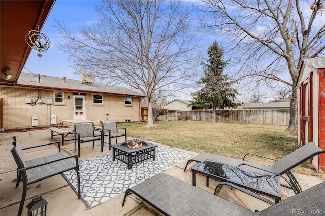 view of patio / terrace featuring fence private yard and a fire pit