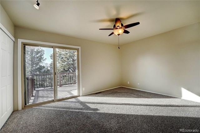 carpeted empty room with ceiling fan