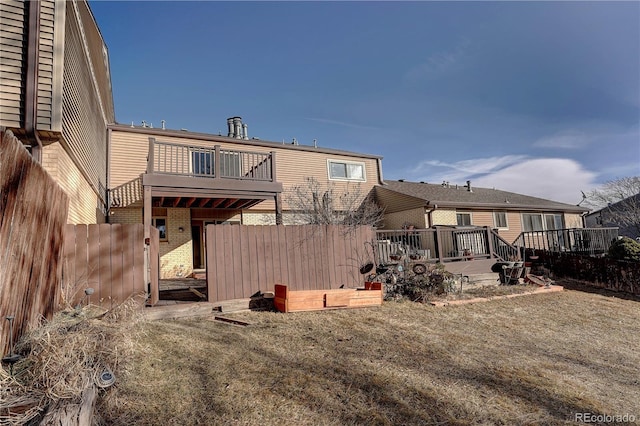 back of property with a balcony